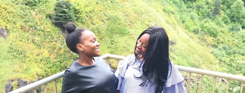 2 ladies smiling, breathtaking landscape