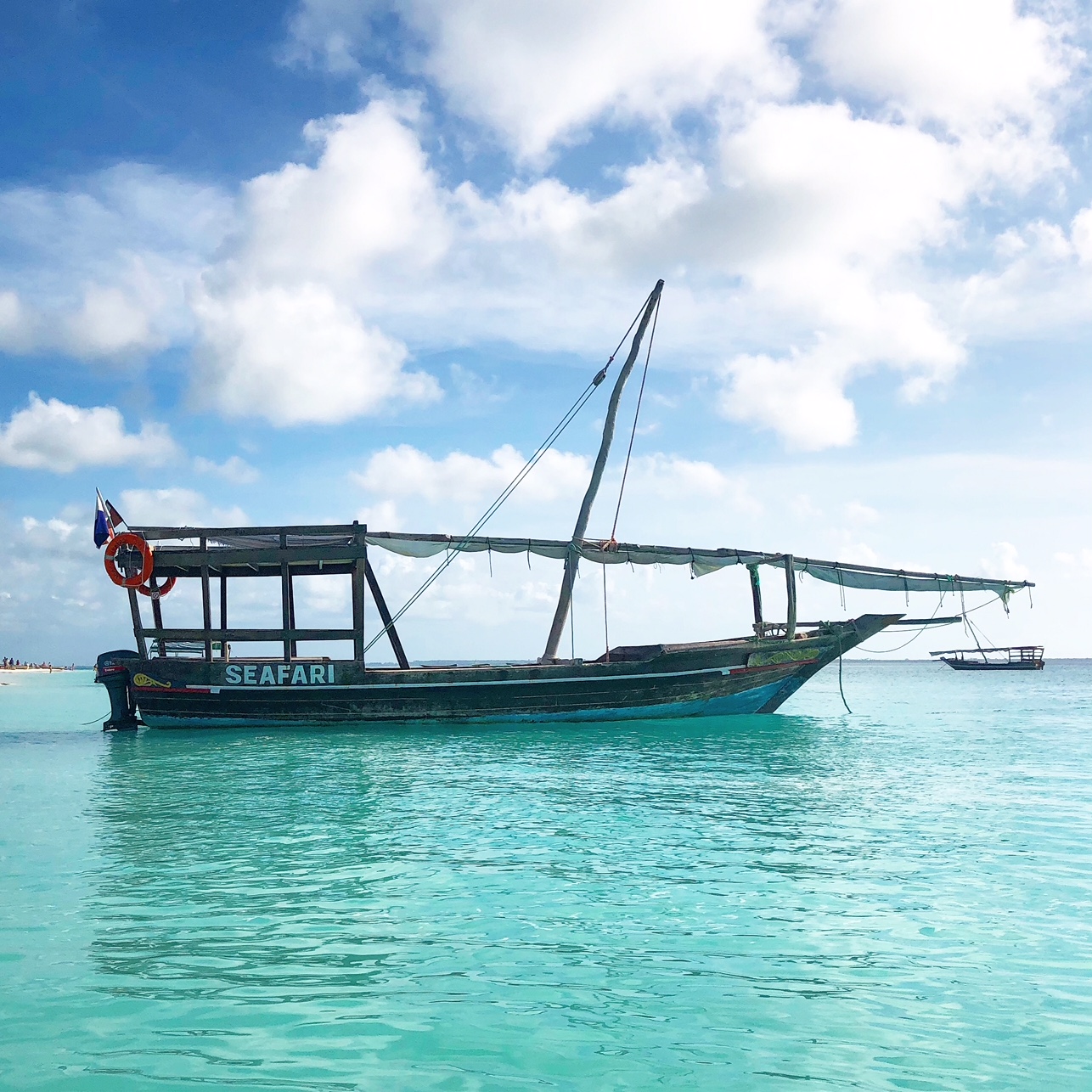 blue sky, pristine water, boat